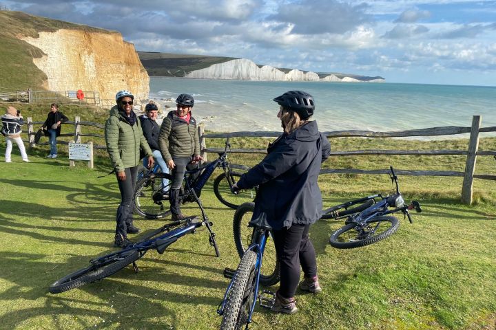 a group of people that are standing in the grass