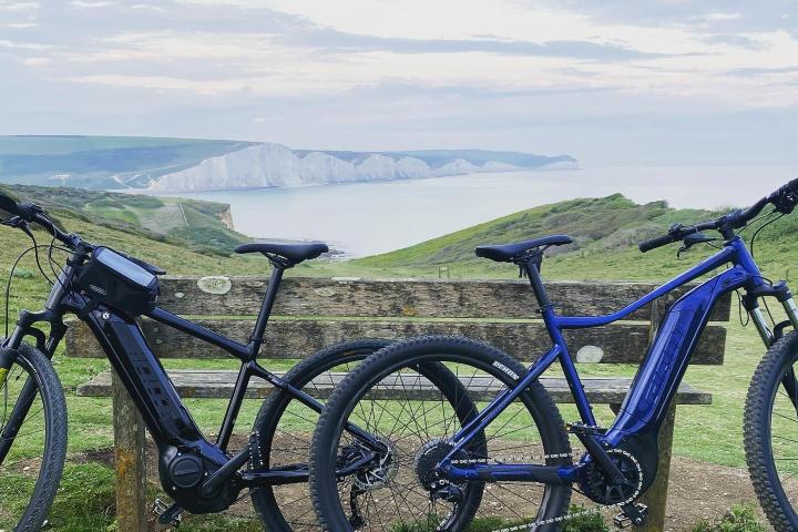 a bicycle is parked next to a body of water