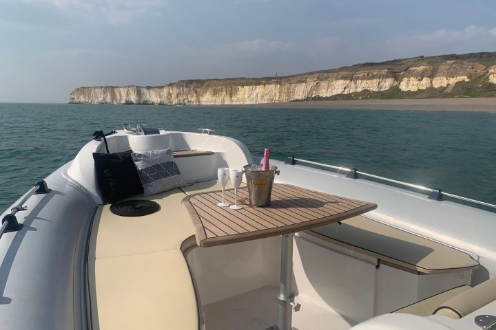 a boat sitting next to a body of water