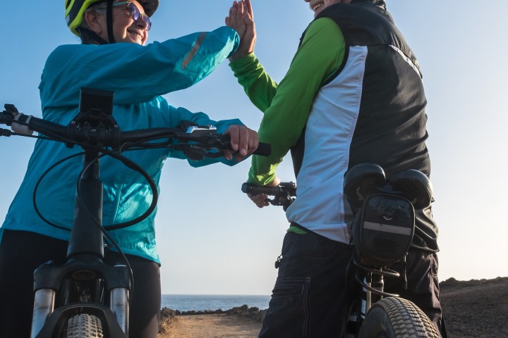 a couple of people that are sitting on a motorcycle