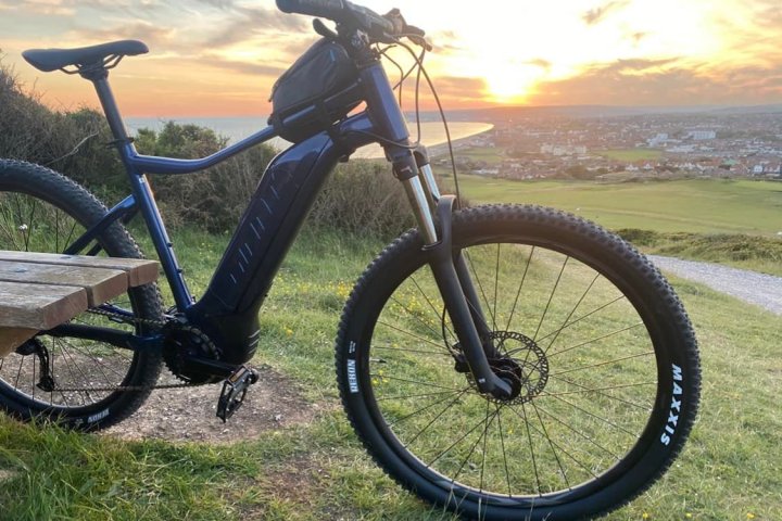a bicycle parked in a grassy field