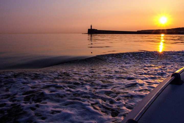 a sunset over a body of water
