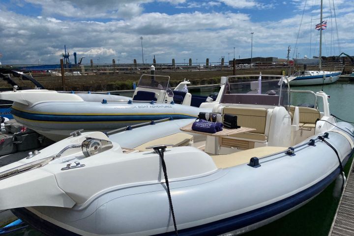 a row of parked motorcycles sitting on top of a boat