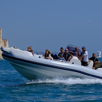 a group of people on a boat in the water