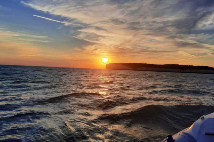 a sunset over a body of water