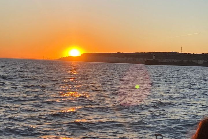 a boat that is sitting in front of a body of water