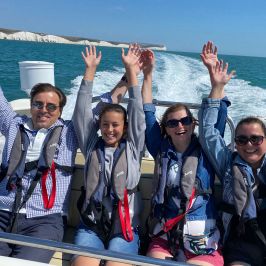 Beatriz Sanchís et al. on a boat posing for the camera