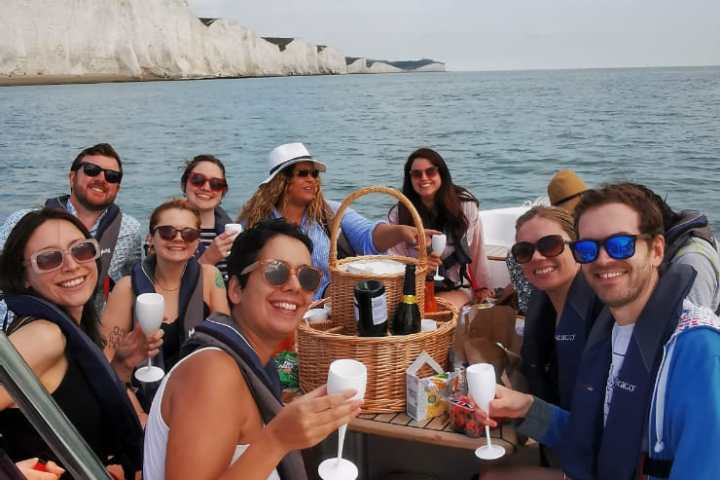 a group of people in a boat on a body of water