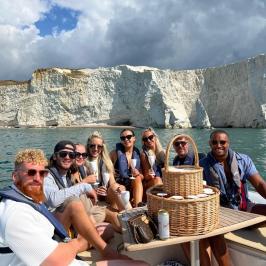 a group of people riding on the back of a boat