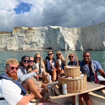 a group of people riding on the back of a boat