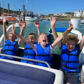 a group of people in a boat on a body of water