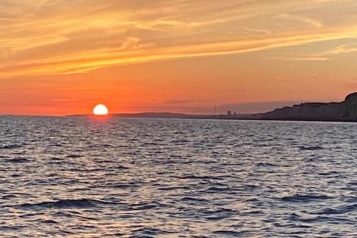 a sunset over a body of water