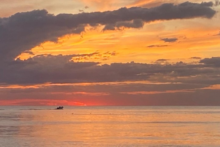 a sunset over a body of water