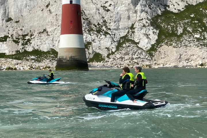 a group of people riding on the back of a boat
