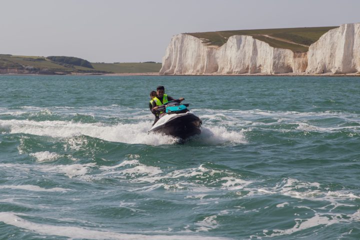 a man riding a wave on a surfboard in the water