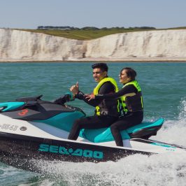a group of people on a boat in the water