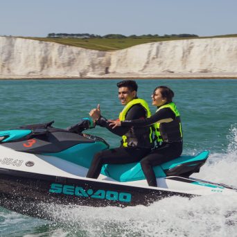 a group of people on a boat in the water