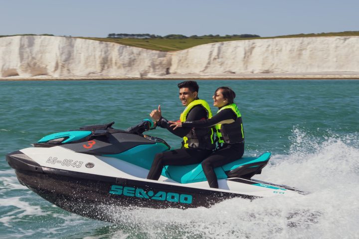 a group of people on a boat in the water