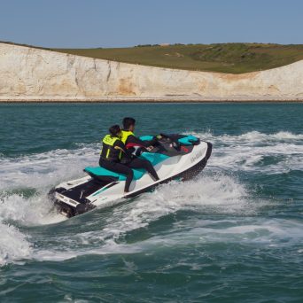 a man riding a wave on top of a body of water