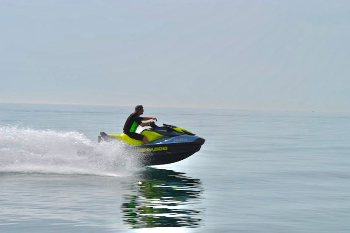 a man riding a wave on a surfboard in the water