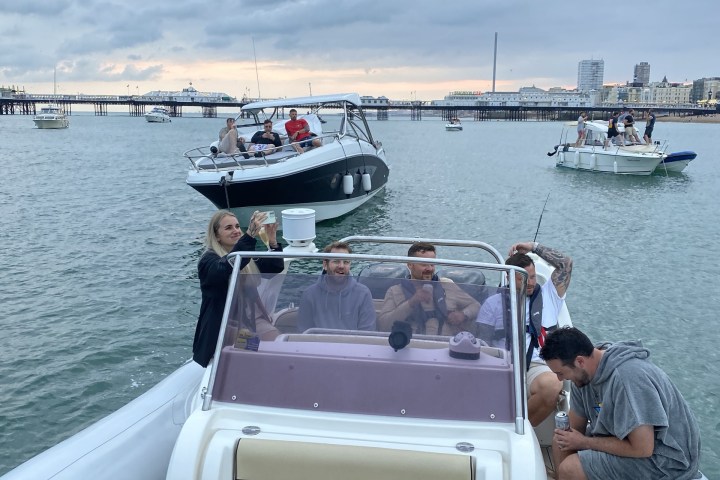 a group of people in a boat on a body of water