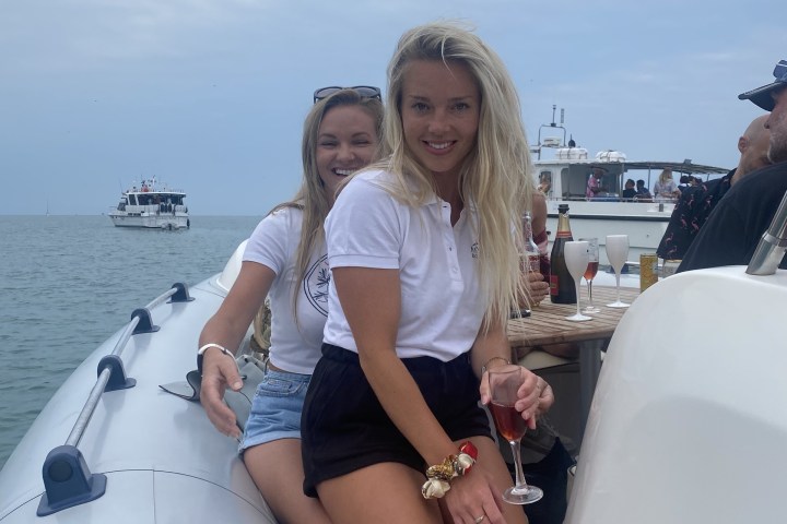 a person standing on a boat in the water