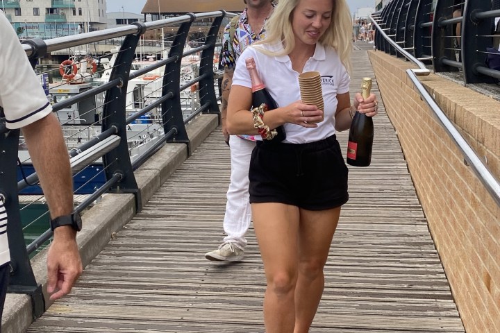 a woman standing on a sidewalk