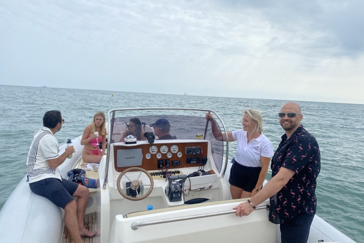 a couple of people that are standing in the water