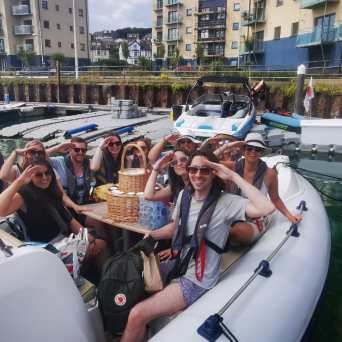 a group of people riding on the back of a boat