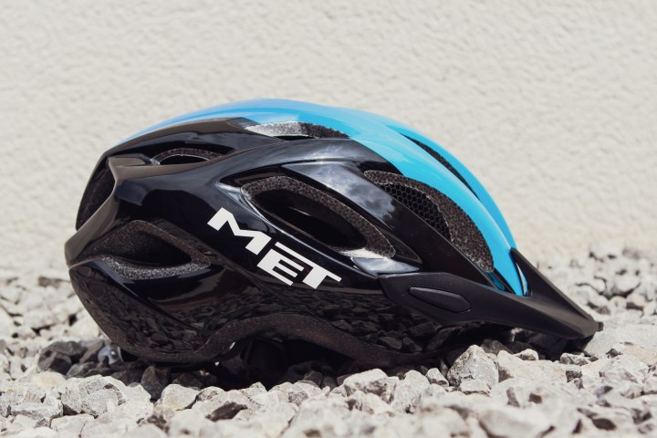 a pair of blue shoes with a helmet on