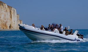 a group of people on a boat in the water
