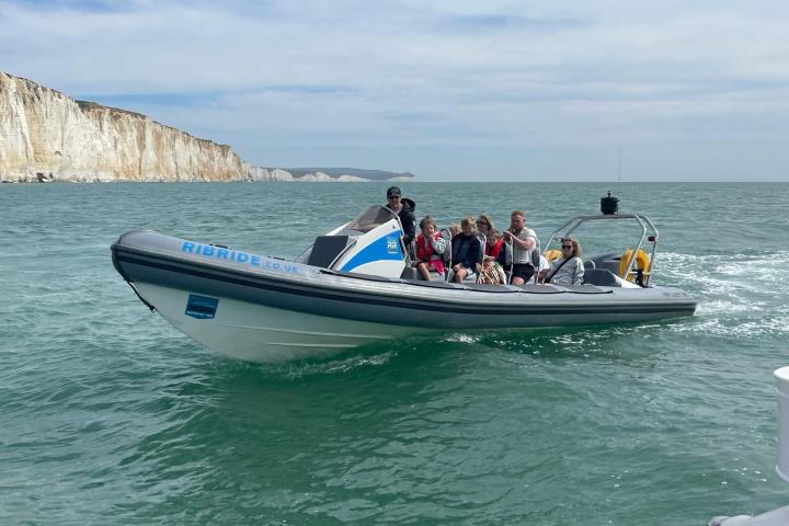 a group of people on a boat in the water
