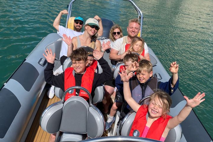 a group of people in a boat on a body of water