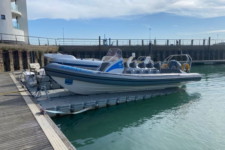 a boat is docked next to a body of water