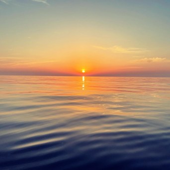 a sunset over a body of water